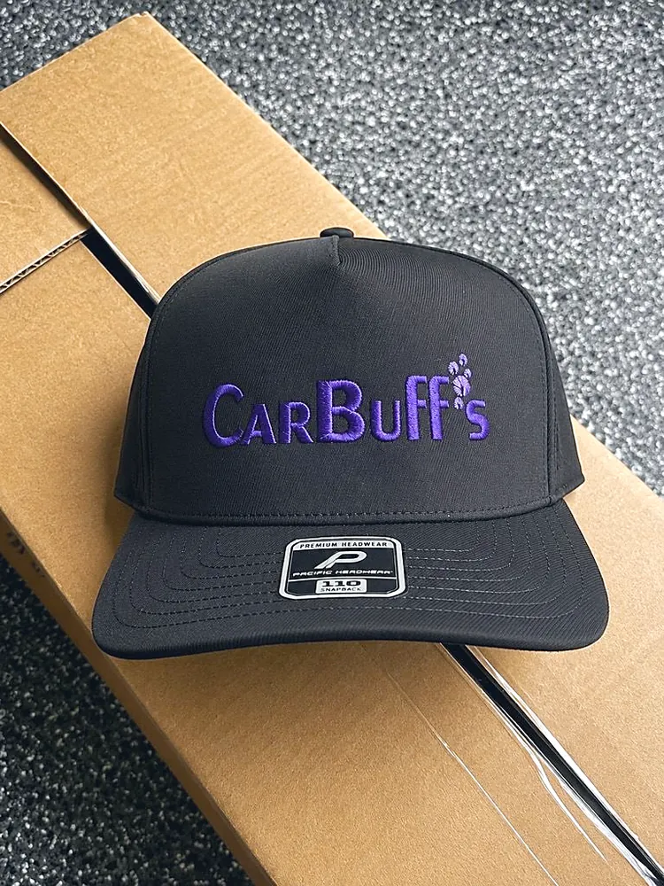 Black snapback cap with purple embroidered CarBuff's logo and paw prints, custom hat embroidery in Wausau, WI