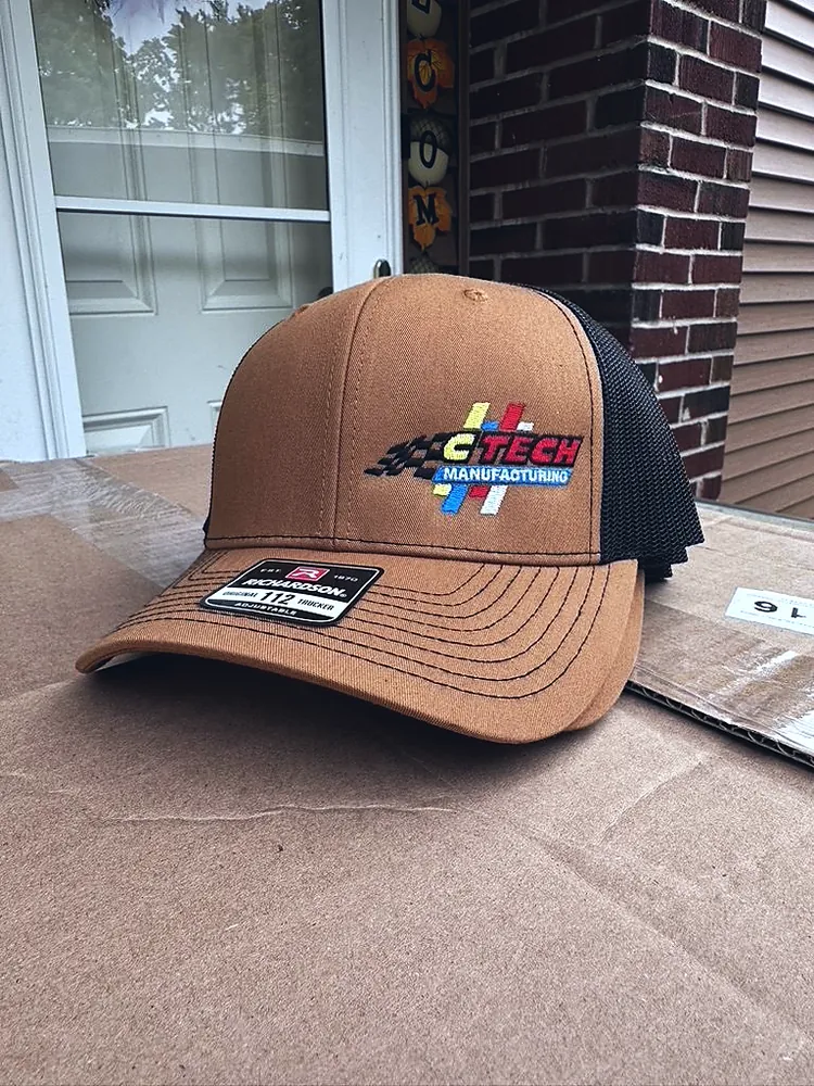 Caramel and black trucker cap with embroidered CTech Manufacturing logo, custom hat embroidery in Wausau, WI