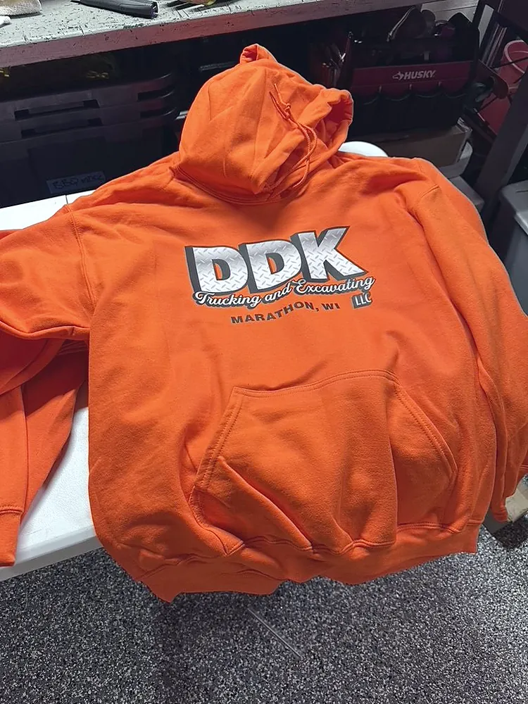 Safety orange hoodie with a printed DDK Trucking and Excavating Marathon WI logo, custom hoodies from Patch Adams Promo