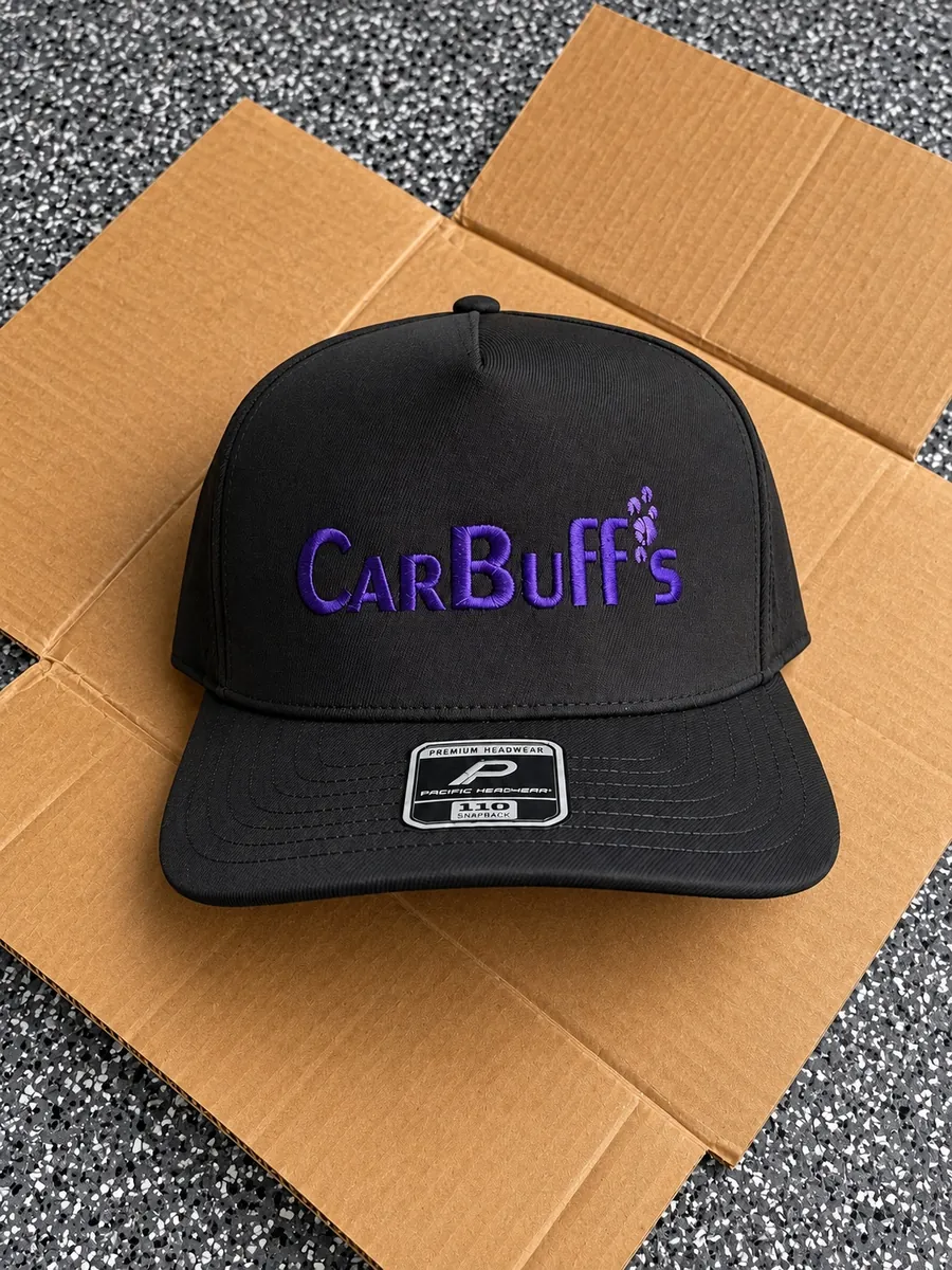 Black snapback cap with purple embroidered CarBuff's logo and paw prints, custom hat embroidery in Wausau, WI