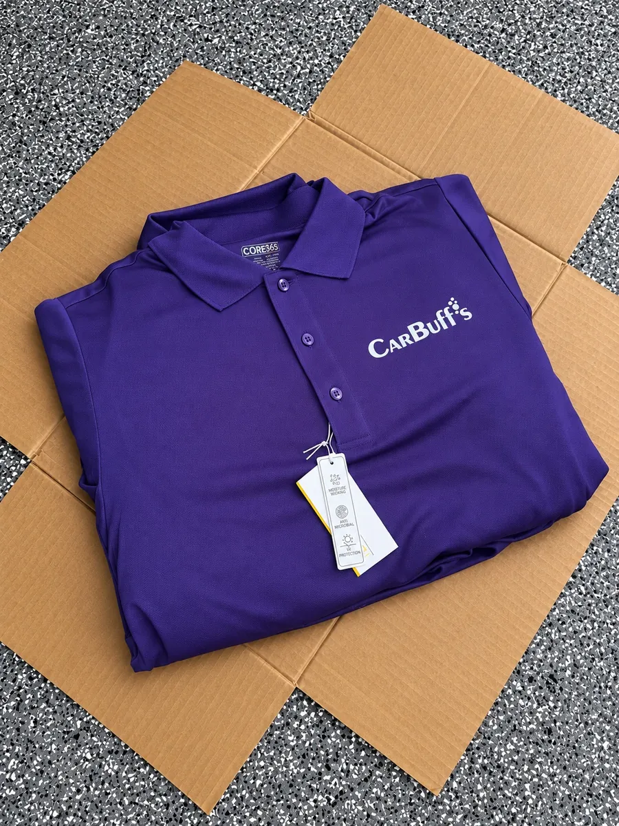 Purple polo shirt with a white embroidered CarBuff's logo on the chest, custom embroidered polos from Wausau, WI