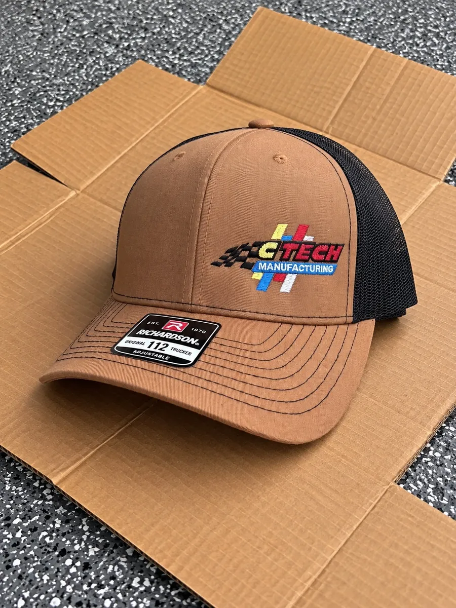 Brown trucker cap with a black mesh back and embroidered CTech Manufacturing racing flag logo, made by Patch Adams Promo in Wausau, WI