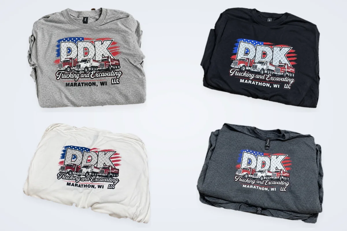 DDK Trucking and Excavating Marathon, WI logo printed on four custom t-shirts in heather gray, navy, white and charcoal, made by Patch Adams Promo in Wausau, WI