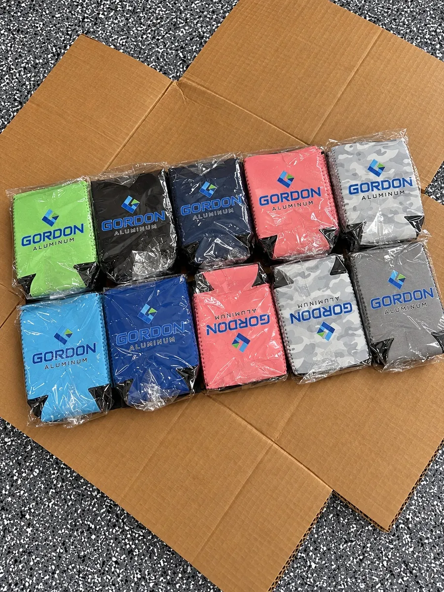 Ten custom can coolers in green, black, blue, coral and gray with a Gordon Aluminum logo, promotional koozies made in Wausau, WI