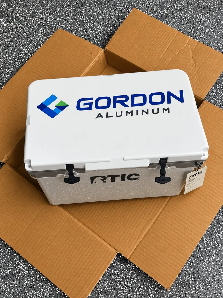 White RTIC cooler with a full-color Gordon Aluminum logo printed on the lid, a custom promotional product from Patch Adams Promo in Wausau, WI