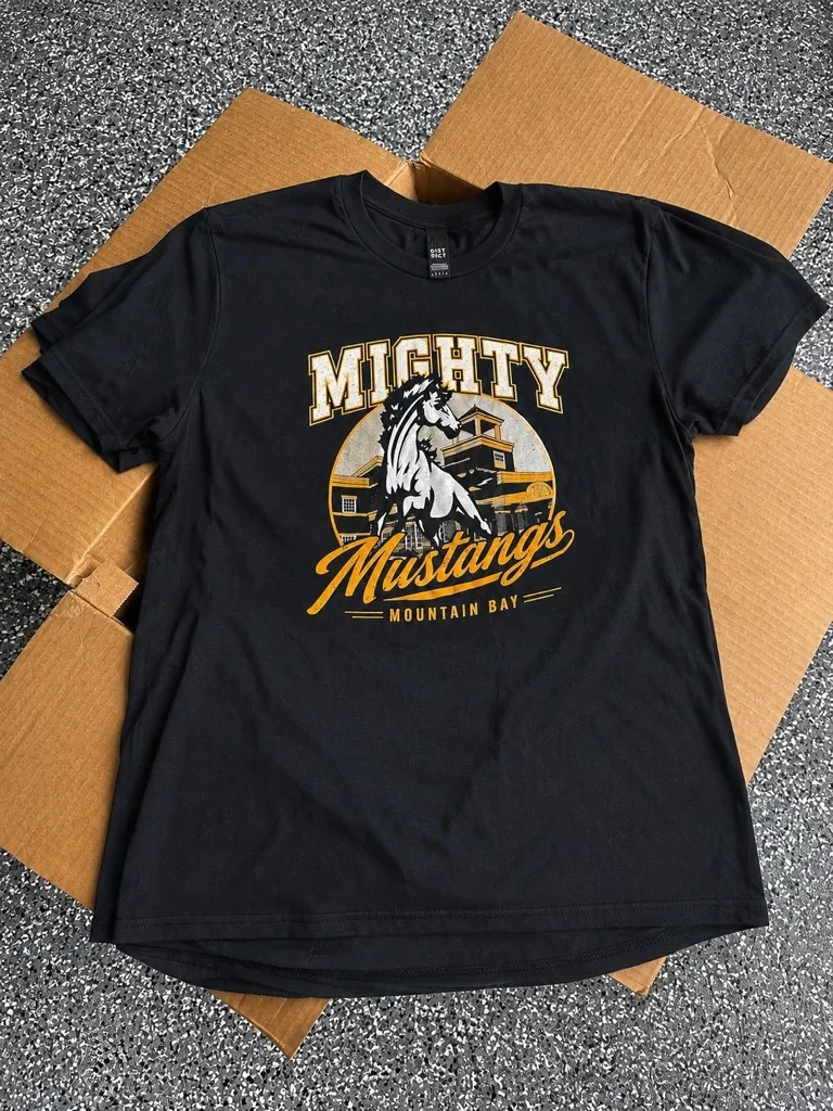Black Mighty Mustangs Mountain Bay spirit wear t-shirt printed in gold and white, custom school apparel from Wausau, WI