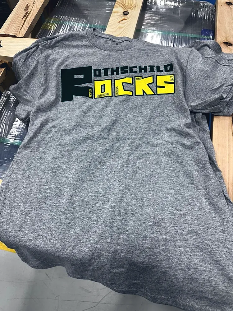 Gray Rothschild Rocks t-shirt with a green and yellow print, custom school and community shirts from Wausau, WI