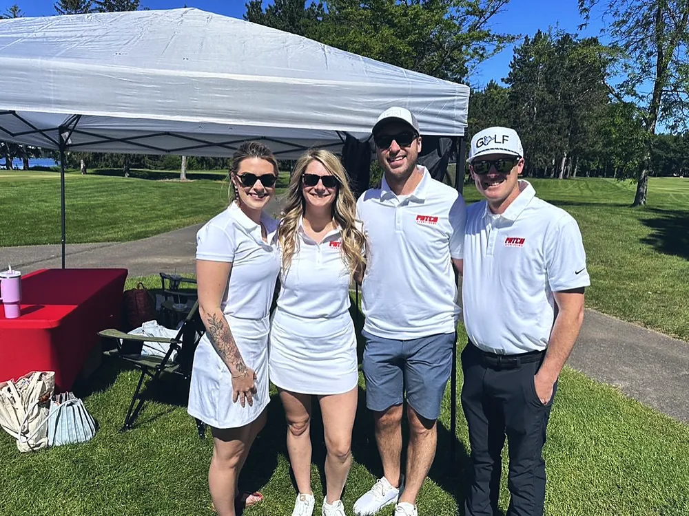 The Patch Adams Promo team in white company polos at a golf outing in Wausau, Wisconsin