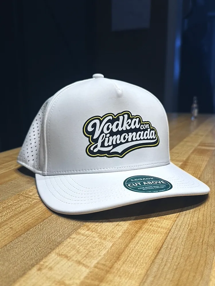 White performance cap with a printed Vodka con Limonada logo patch, custom hats from Patch Adams Promo in Wausau, WI